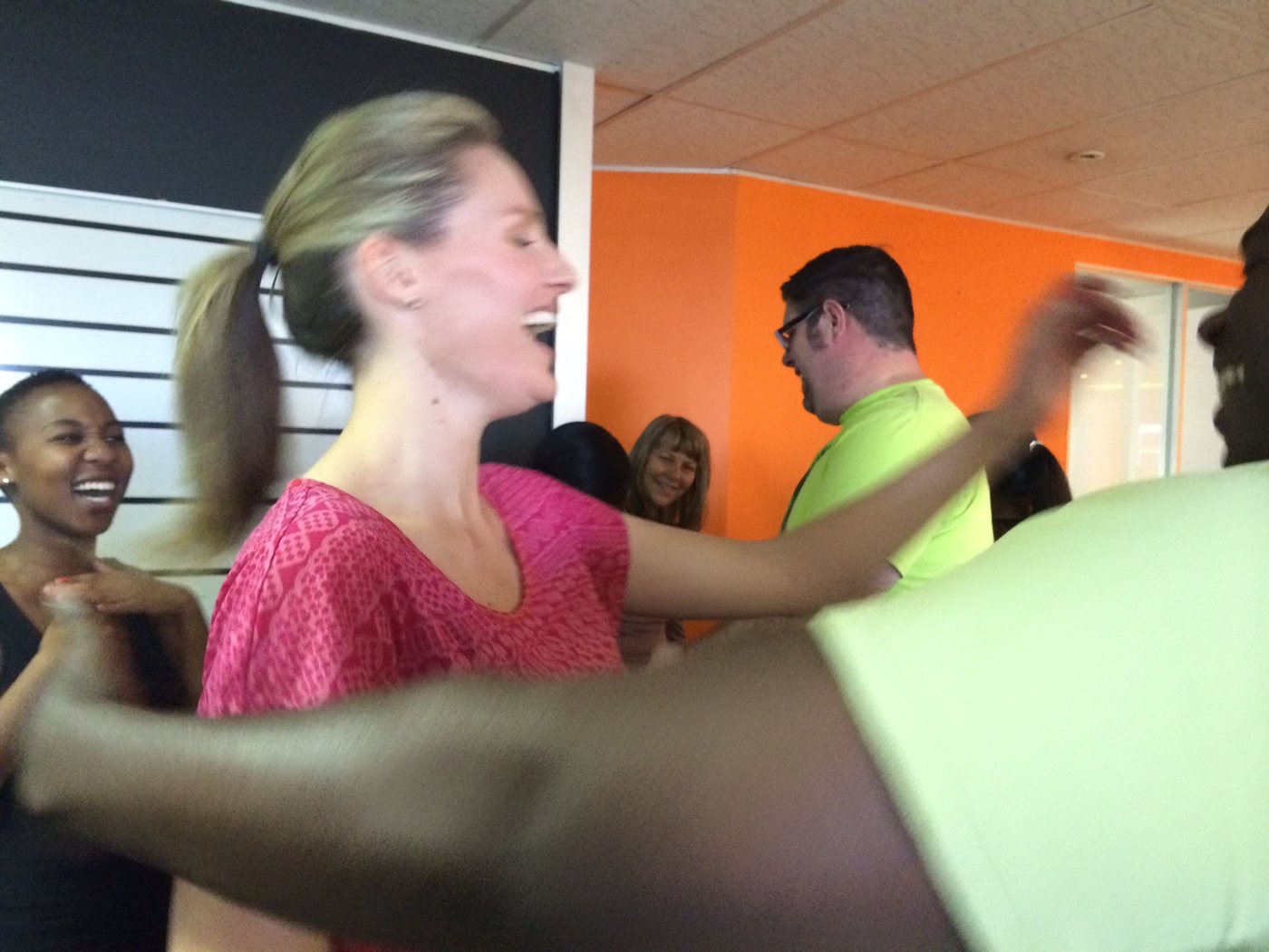 Shareen Richter laughing with a delegate in a small-group session