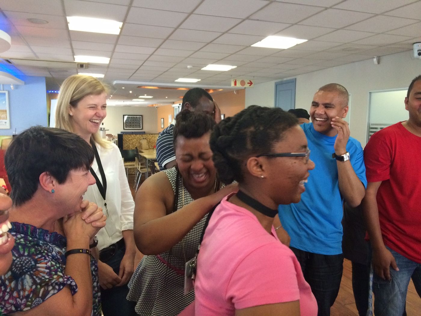 Delegates doubled over laughing during a corporate session